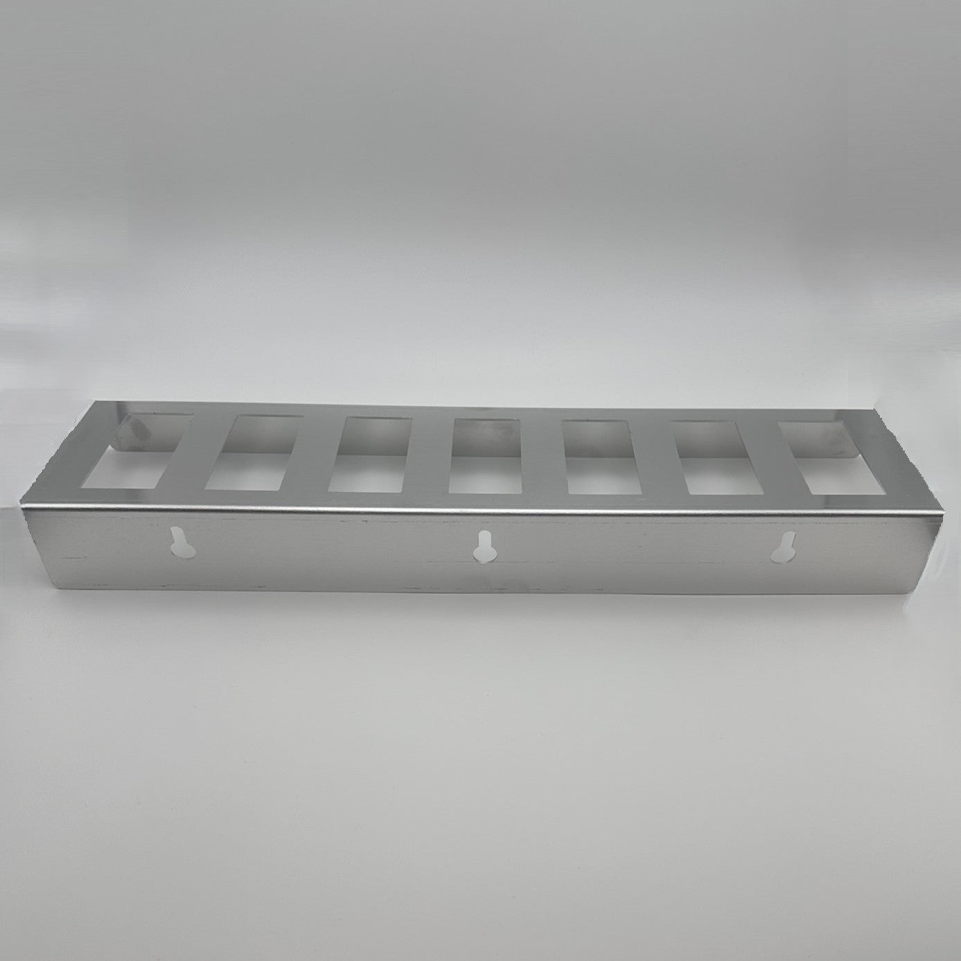 Efficiently organize your kitchen with the 7 Slot Metal Dispensing Rack Complete with Label Carriers for easy label access.