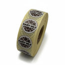 Roll of 'Dairy Milk' labels on a white background